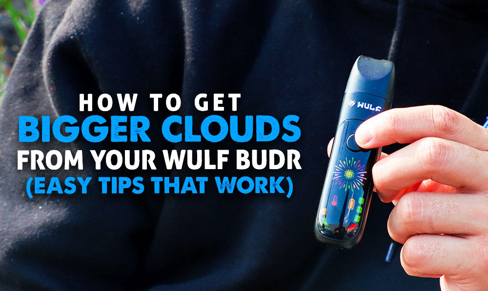 man holding the Wulf Budr Portable Concentrate Vaporizer outside with blue and white text